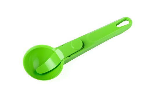 green plastic spoons for ice cream isolated on white background
