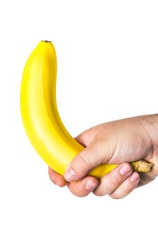 man's hand holding a banana like a big penis that symbolizes erection and potency