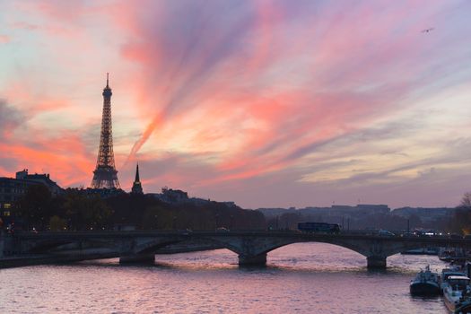 Beautiful colorful sunset over Eiffel Tower and Seine river. Paris, France.