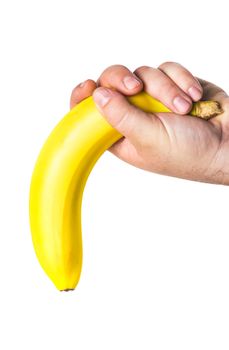 man's hand holding a banana like a big penis upside down that symbolizes lack of erection and impotence