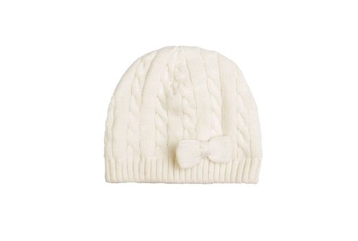 white Warm knitted woolen girl's hat with a bow isolated on white 