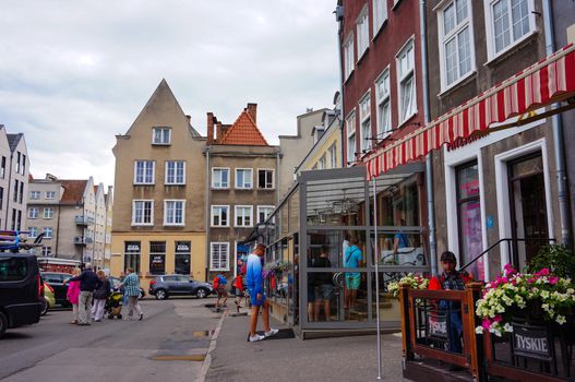 GDANSK, POLAND - JULY 29, 2015: People by restaurants and cafes in the city center