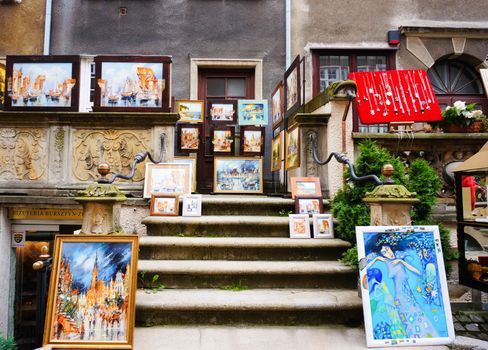 GDANSK, POLAND - JULY 29, 2015: Artwork paintings exhibition in front of a building 