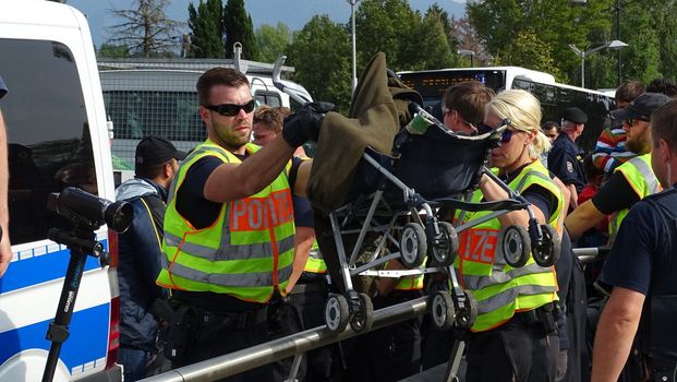 AUSTRIA, Salzburg: Scores line up at the border control in Salzburg, Austria on September 22, 2015 amid an ongoing refugee crisis, which has seen thousands flee from Syria and other war-torn countries for safety in Europe.
