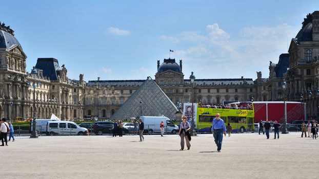 Paris, France - May 13, 2015: Tourist visit Louvre museum on May 13, 2015 in Paris. This is one of the most popular tourist destinations in France.