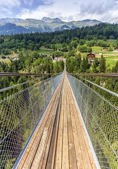 Lama suspended bridge and Alps mountains, Valais, Switzerland