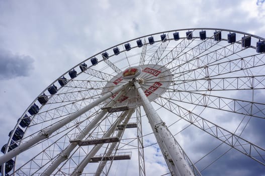 GDANSK, POLAND - JULY 29, 2015: Large fair wheel with Tyskie logo at the city center
