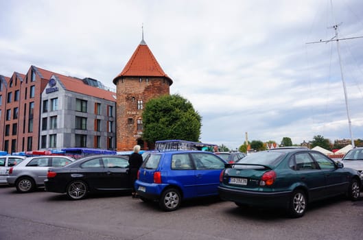 GDANSK, POLAND - JULY 29, 2015: Parked cars close by a Hilton hotel