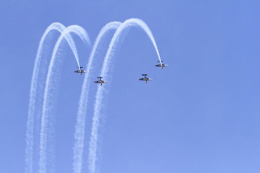 ENGLAND, Southport: Planes fly in formation leaving smoke trails during the Southport Airshow 2015 in Southport, Merseyside in England on September 19, 2015
