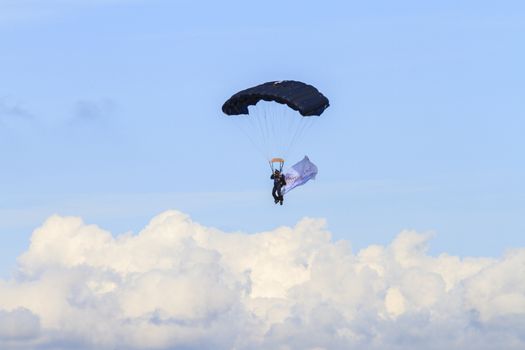ENGLAND, Southport: A pilot parachutes through the air during the Southport Airshow 2015 in Southport, Merseyside in England on September 19, 2015
