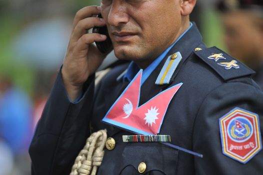 NEPAL, Kathmandu: A man wearing military attire attends celebrations in Kathmandu, Nepal on September 21, 2015, one day after the government unveiled the country's first democratic constitution in a historic step. Out of the 598 members of the Constituent Assembly, 507 voted for the new constitution, 25 voted against, and 66 abstained in a vote on September 16, 2015. The event was marked with fireworks and festivities, but also with protests organized by parties of the Tharu and Madhesi ethnic communities.Photos taken by Newzulu contributor Narayan Maharjan show the Nepalese people donning traditional garb and celebrating with folk music and dancing.