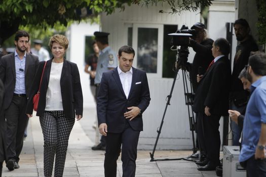 GREECE, Athens: Alexis Tsipras (right), the Prime Minister of Greece, and Olga Gerovasili (left), the designated government spokeswoman, arrive at the Presidential Mansion for the swearing-in ceremony in Athens, Greece on September 23, 2015. The ceremony took place at the Presidential Mansion, three days after the victory of SYRIZA (Coalition of the Radical Left) in the second Greek General Election in eight months.The implementation of the bailout, agreed after months of bitter negotiations, will be the government's overwhelming task.
