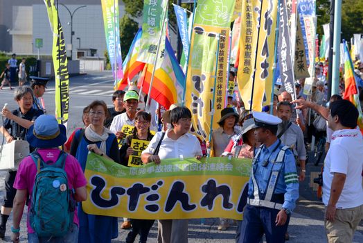 JAPAN, Tokyo : Thousands of people protest in Tokyo outside of Japan's parliament against new legislation that would allow the military to deploy overseas on September 23, 2015. The changes would allow Japanese troops to fight abroad for the first time since World War Two. 