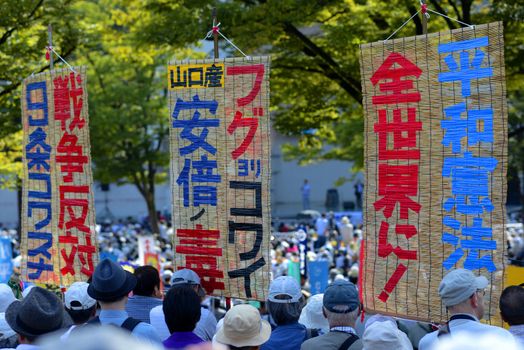 JAPAN, Tokyo : Thousands of people protest in Tokyo outside of Japan's parliament against new legislation that would allow the military to deploy overseas on September 23, 2015. The changes would allow Japanese troops to fight abroad for the first time since World War Two. 