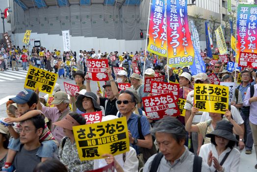 JAPAN, Tokyo : Thousands of people protest in Tokyo outside of Japan's parliament against new legislation that would allow the military to deploy overseas on September 23, 2015. The changes would allow Japanese troops to fight abroad for the first time since World War Two. 