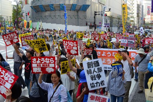 JAPAN, Tokyo : Thousands of people protest in Tokyo outside of Japan's parliament against new legislation that would allow the military to deploy overseas on September 23, 2015. The changes would allow Japanese troops to fight abroad for the first time since World War Two. 