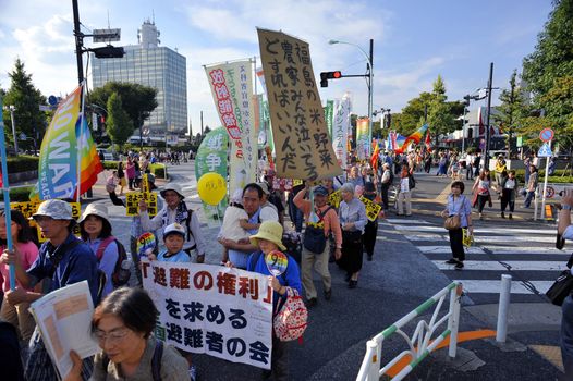 JAPAN, Tokyo : Thousands of people protest in Tokyo outside of Japan's parliament against new legislation that would allow the military to deploy overseas on September 23, 2015. The changes would allow Japanese troops to fight abroad for the first time since World War Two. 