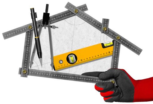 Hand holding a metal meter ruler in the shape of house with a pencil, drawing compass and a spirit level on a white paper. Concept of house project