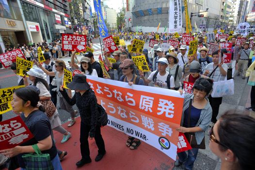 JAPAN, Tokyo : Thousands of people protest in Tokyo outside of Japan's parliament against new legislation that would allow the military to deploy overseas on September 23, 2015. The changes would allow Japanese troops to fight abroad for the first time since World War Two. 