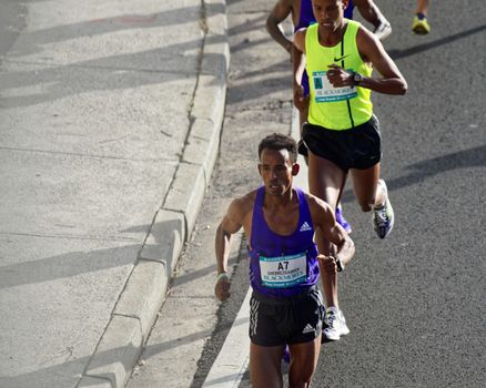 AUSTRALIA, Sydney: Eritrean Kibrom Ghebrezgiabhier runs in the Sydney Marathon held during the Sydney Running Festival on September 20, 2015. Around 30,000 participants took part in the 15th Sydney Running Festival which incorporates a 42km marathon, a half marathon, a 9km bridge run as well as a 3.5km family fun run