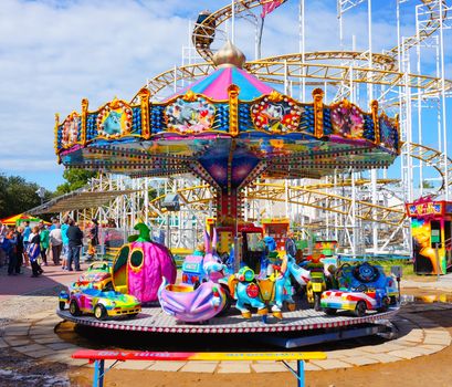 USTRONIE MORSKIE, POLAND - JULY 20, 2015: Colorful child carousel on a sunny day 