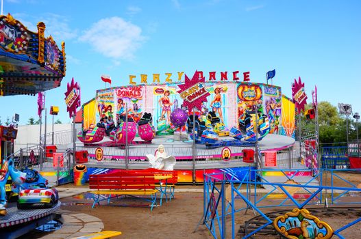 USTRONIE MORSKIE, POLAND - JULY 20, 2015: Colorful Crazy Dance attraction at a fair