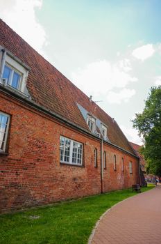 Long farm building next to footpath