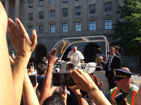 USA, Washington DC: Pope Francis rides the Popemobile through Washington DC on September 23, 2015, greeting devotees during his historic first trip to the US. He earlier met President Barack Obama and gave a speech at the White House, during which he told the public that climate change is a problem that can no longer be left to our future generation.