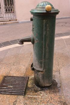 Retro metal Fountain in the old city of Nice in France