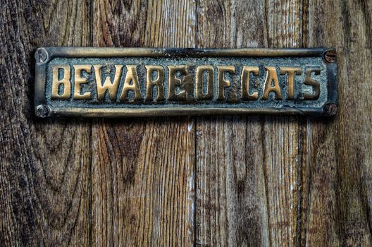 Beware Of Cats Sign On A Heavy Wooden Door
