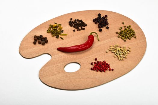 Palette of spices, collection of various spices on wooden palette isolated on white