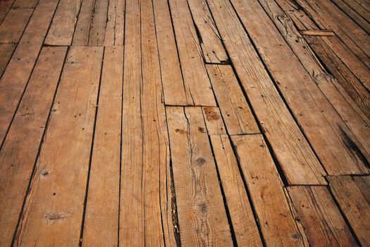 Old vintage rustic aged antique wooden sepia surface with gaps in perspective