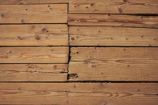 Old vintage rustic aged antique wooden sepia panel with horizontal gaps, planks and chinks