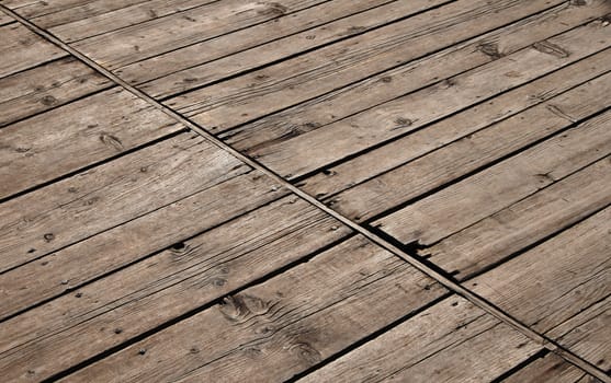 Old vintage rustic aged antique wooden sepia panel with diagonal gaps, planks and chinks