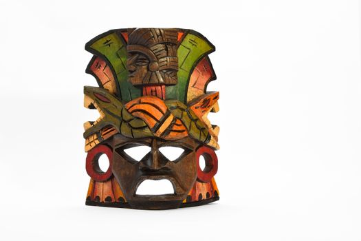 Indian Mayan Aztec wooden mask with anaconda and jaguar isolated on white background