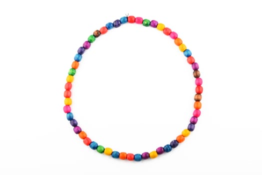 Colorful handmade wooden painted round beads necklace isolated on white
