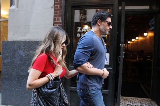 USA, New York: Addicted to cake, vivacious Modern Family superstar Sofia Vergara hurries to her car with Hollywood-hunk fiancee Joe Manganiello after visiting Ron Ben-Israel Cakes in Midtown Manhattan on September 23, 2015. Bakery staff confirmed that the super couple was at the shop; but when asked if the pair had decided to buy their wedding cake from the bakery, one employee revealed that it was all up in the air.