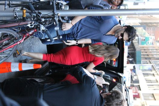 USA, New York: TV star Joe Manganiello gets into his car after visiting Ron Ben-Israel Cakes in Midtown Manhattan with superstar fiancee Sofia Vergara (center) on September 23, 2015. Bakery staff confirmed that the super couple was at the shop; but when asked if the pair had decided to buy their wedding cake from the bakery, one employee revealed that it was all up in the air.