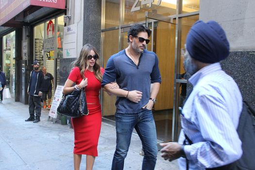 USA, New York: Addicted to cake, vivacious Modern Family superstar Sofia Vergara hurries to her car with Hollywood-hunk fiancee Joe Manganiello after visiting Ron Ben-Israel Cakes in Midtown Manhattan on September 23, 2015. Bakery staff confirmed that the super couple was at the shop; but when asked if the pair had decided to buy their wedding cake from the bakery, one employee revealed that it was all up in the air.