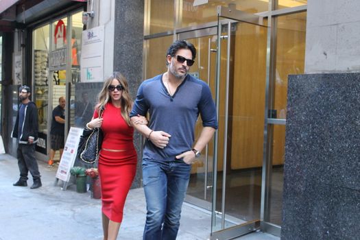 USA, New York: Addicted to cake, vivacious Modern Family superstar Sofia Vergara hurries to her car with Hollywood-hunk fiancee Joe Manganiello after visiting Ron Ben-Israel Cakes in Midtown Manhattan on September 23, 2015. Bakery staff confirmed that the super couple was at the shop; but when asked if the pair had decided to buy their wedding cake from the bakery, one employee revealed that it was all up in the air.