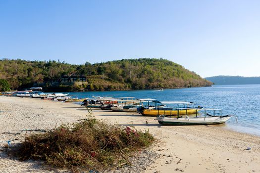 romantic Small boats on nusa penida beach, Bali Indonesia with blue sky, tranquil scene