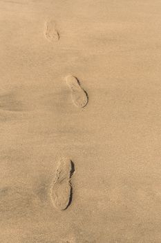Nusa Penida, Crystal beach, Footprints in the sand. Bali Indonesia