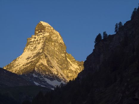 Matterhorn mountain in the morning, seen from Zermatt, Canton of Valais, Switzerland. Its summit is 4,478 metres (14,692 ft) high, making it one of the highest peaks in the Alps