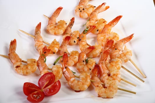shrimp skewers on white plate