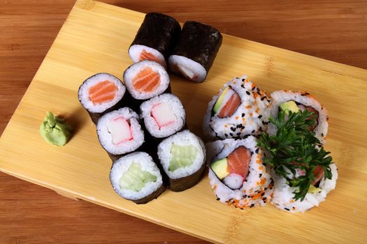 sushi on wood plate