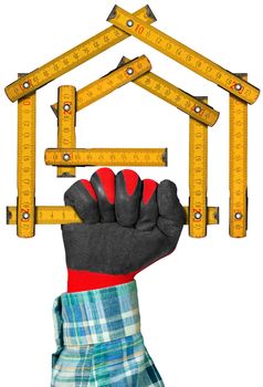 Hand with red and black work glove holding a yellow wooden meter ruler in the shape of house isolated on white background. Concept of house project 
