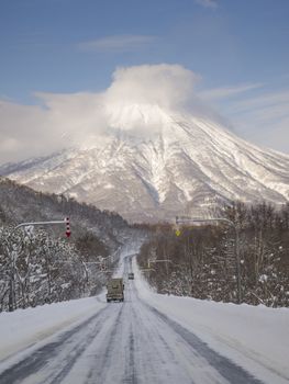 Road in winter which continues to Mt. Yotei, an active stratovolcano located in Shikotsu-Toya National Park, Hokkaido, Japan. It is one of the 100 famous mountains in Japan.