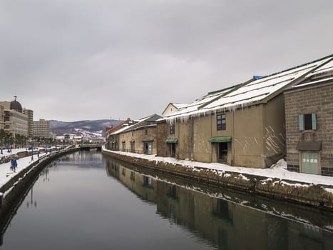 Warehouses along the Otaru canal in Otaru city, Hokkaido, Japan. Otaru served as a major trade and fishing port date from early colonialization of Hokkaido in the early 1800's.
