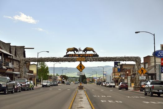 Afton, Wyoming, USA; June 02, 2015: In Afton city exist the world's largest Elkhorn Arch. Panoramic view of the street with cars and shops. June 02, 2015, Afton, Wyoming, USA.
