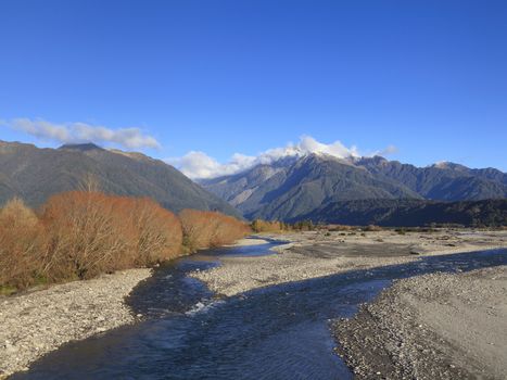 Poerua River and the Southern Alps, West Coast, South Island, New Zealand.